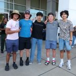 Group of five male students outside