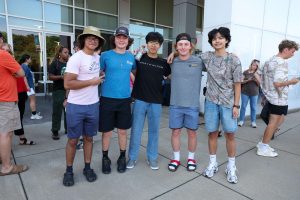 Group of five male students outside