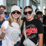 two female students with a gift card